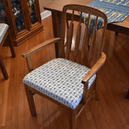 Wooden dining armchair with a freshly reupholstered seat