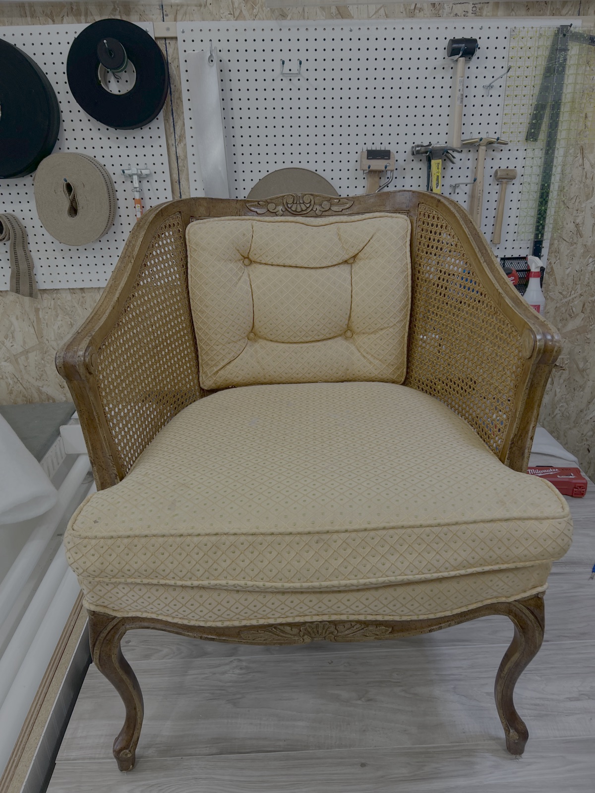 Caned barrel chair before reupholstery
