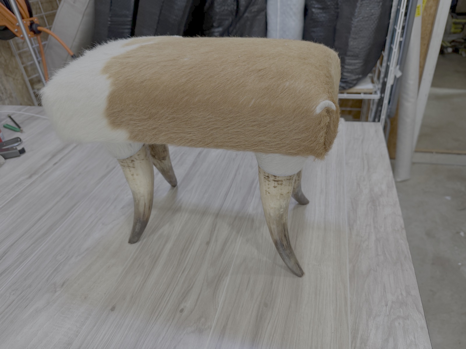 Horn-leg footstool before reupholstery